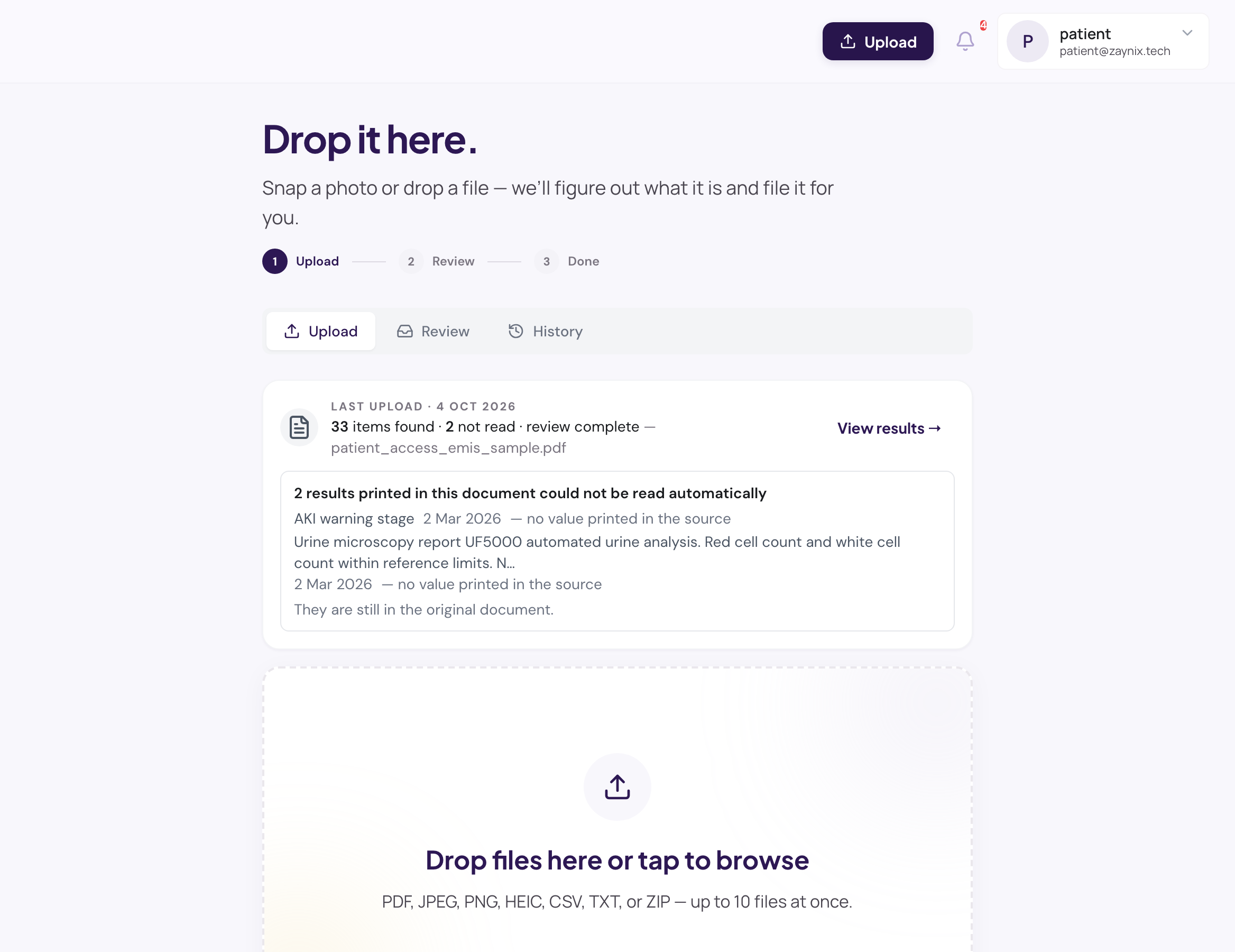 The Upload page: the last upload’s result — 33 items found, 2 not read, each unread result named — above the drop zone for documents and photos.